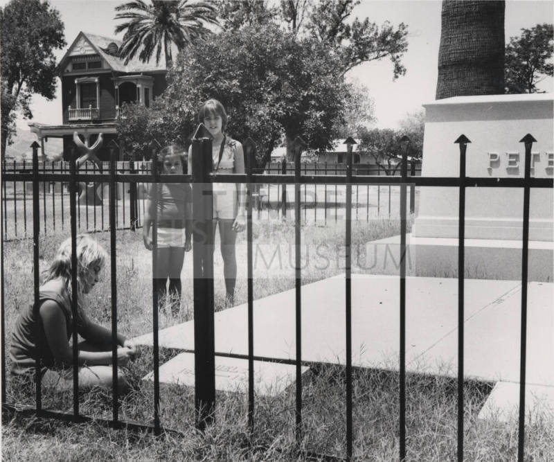 Three Girls Looking at Petersen Headstone