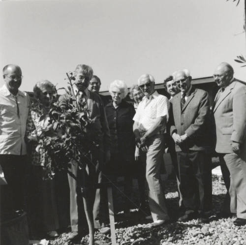 Group of people at a tree planting ceremony, A Lot of Caring