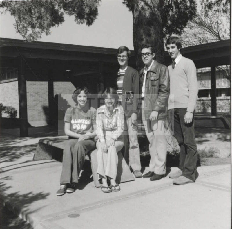 Five young people in a courtyard