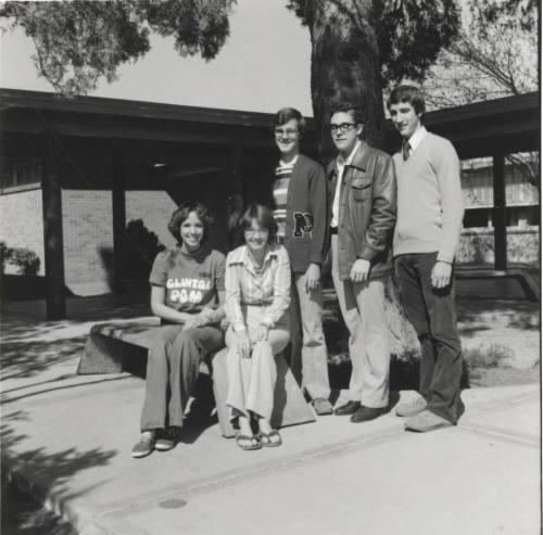 Five young people in a courtyard