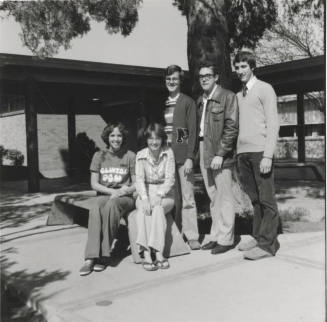 Five young people in a courtyard