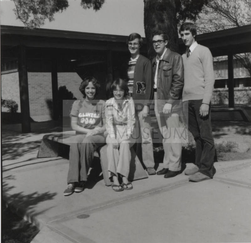 Five young people in a courtyard