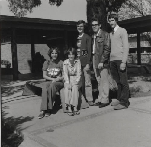 Five young people in a courtyard