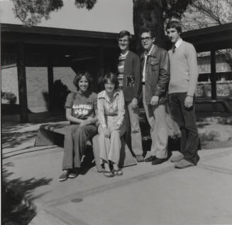 Five young people in a courtyard