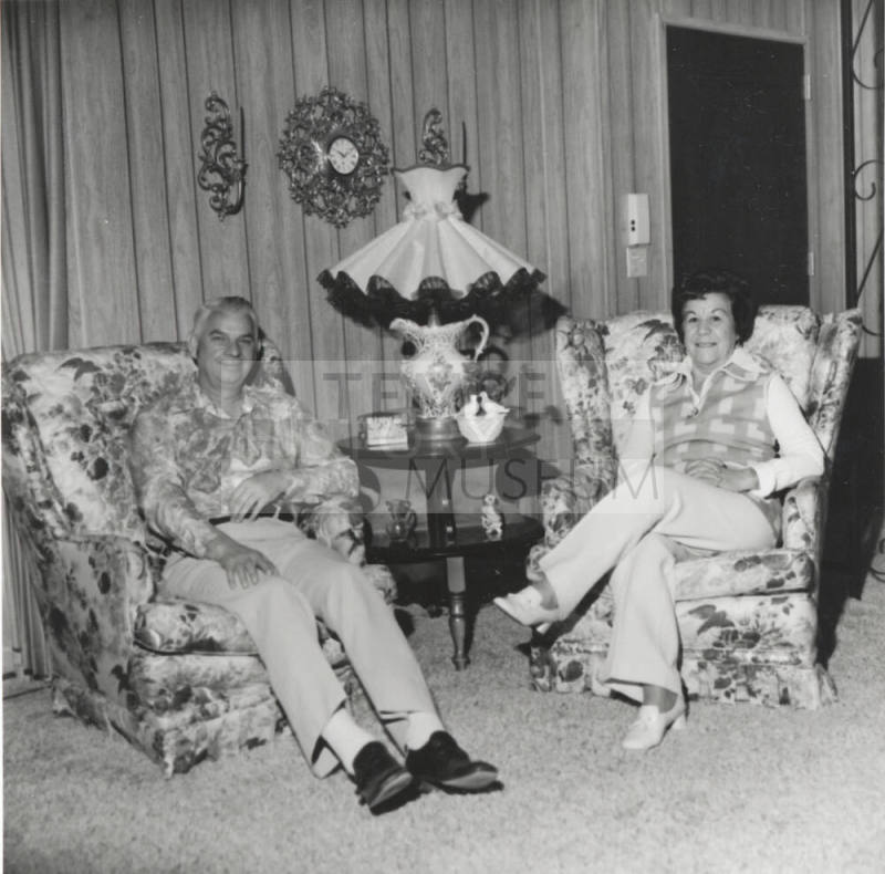 A Couple Sitting in Two Armchairs