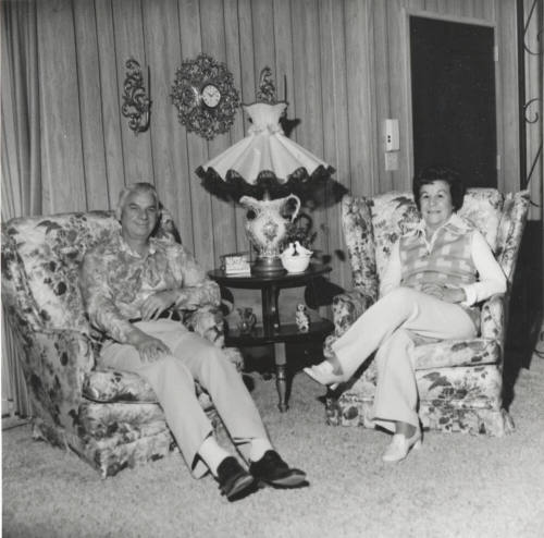 A Couple Sitting in Two Armchairs