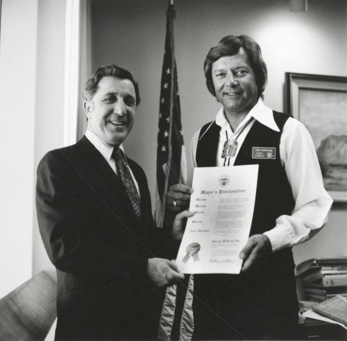 Mayor Bill LoPiano presents a "Harvey McKemy Day in Tempe" proclamation to Tempe Diablos president, Don Robinson.