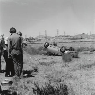 Car Flipped Over in Salt River Bed, North of Mill Ave. and 1st