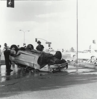 Car Overturns after hitting Median