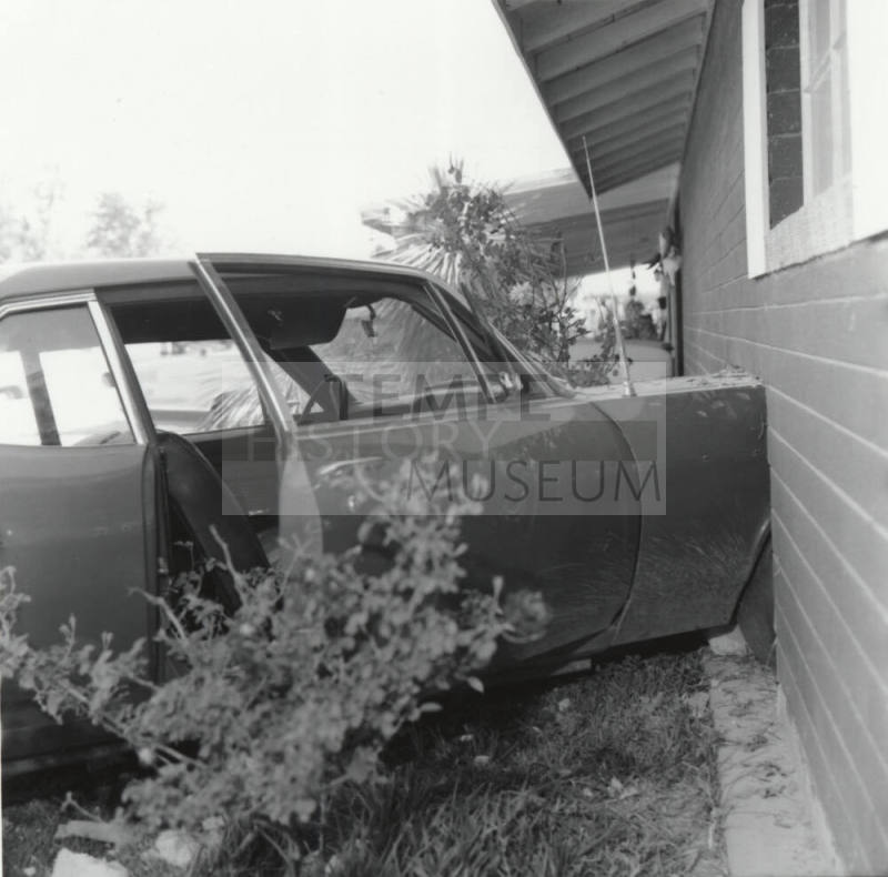 Car Travels into Living Room