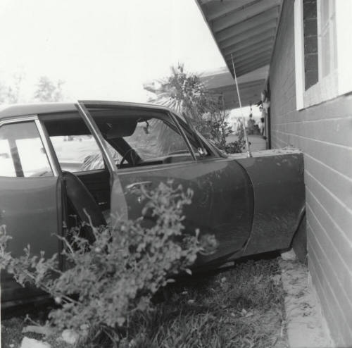 Car Travels into Living Room