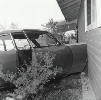 Car Travels into Living Room