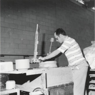 Unidentified picture with a man and a pottery wheel