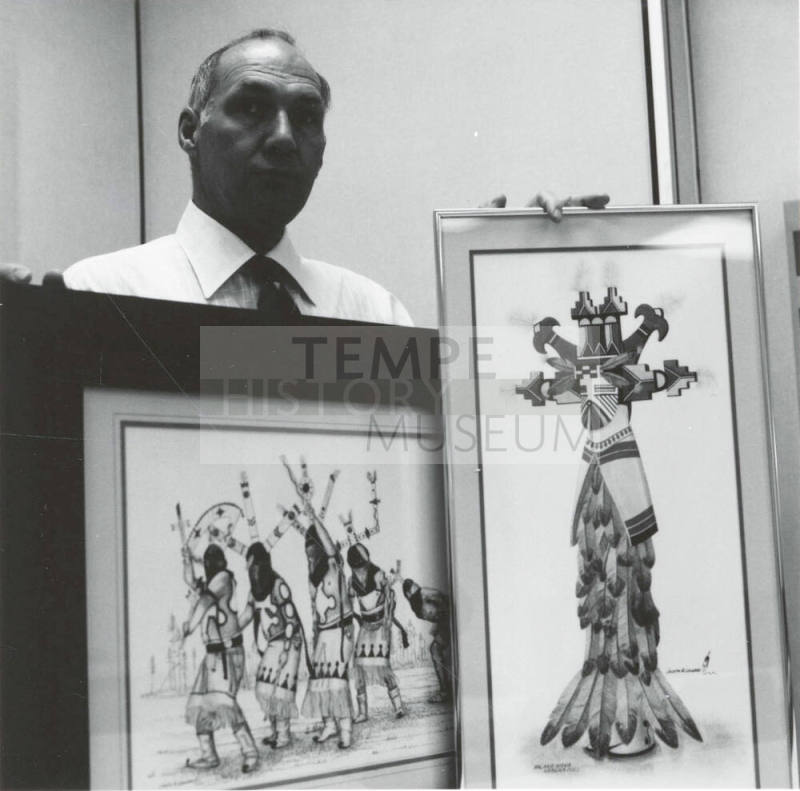 Unidentified Man with Two Native American Paintings