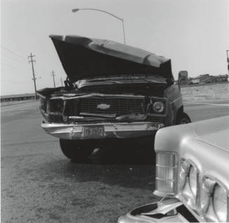 Wrecked Chevrolet car on Rural Road