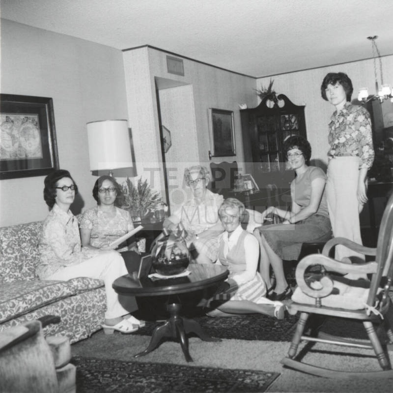 Group of women in a living room.