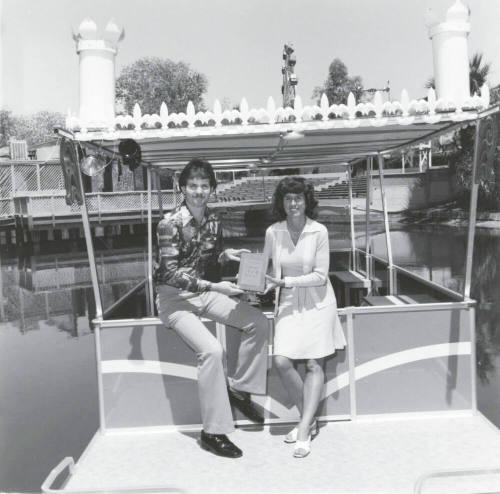 A Couple Displays a Plaque at Legend City