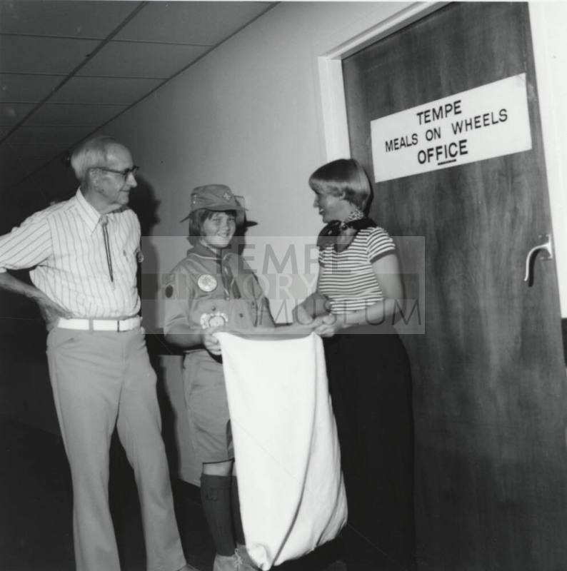 Girl Scout Collecting Cans - May 1977
