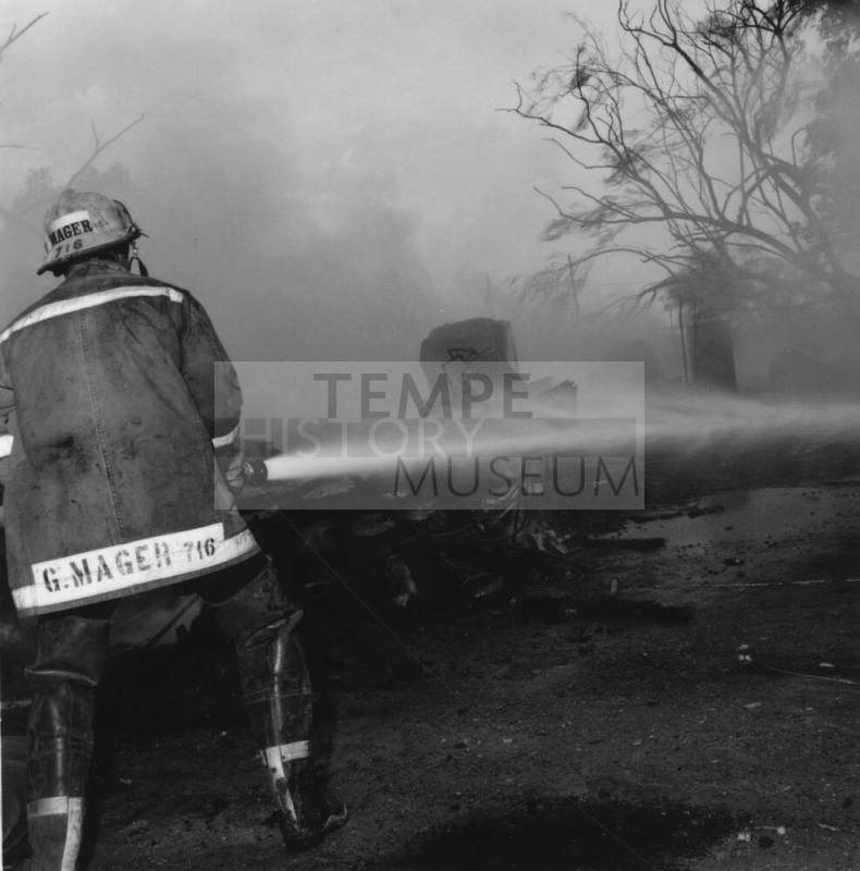 Firefighter and hose. - June 9 1977