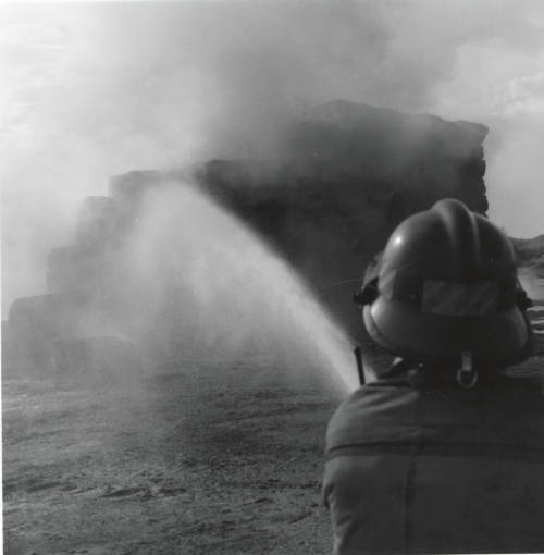 Firefighter Hoses Down a Hay Fire - Tempe Daily News, June 9, 1977