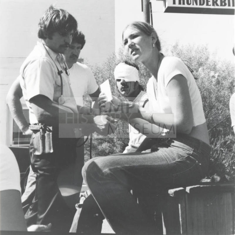 Injured man and woman. - June 1977