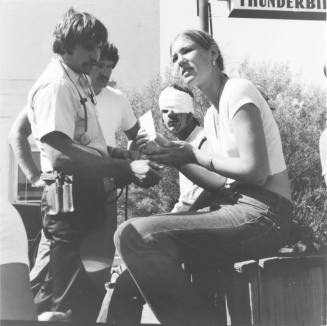 Injured man and woman. - June 1977