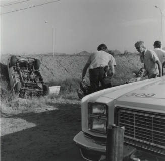 Roll-Over Accident, Injured Man and Woman - June 1977