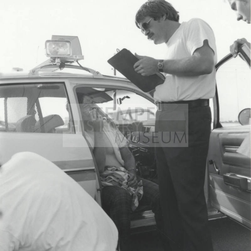 Injured man and woman. - June 1977