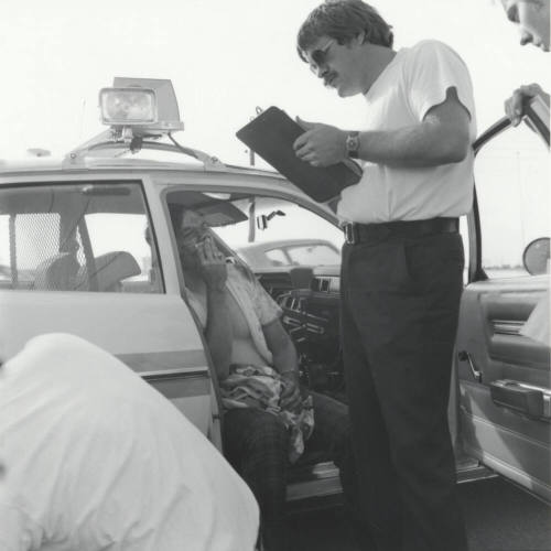Injured man and woman. - June 1977