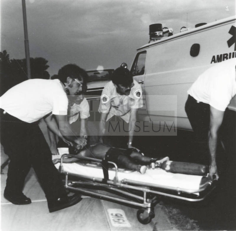 Unidentified EMTs and Ambulance