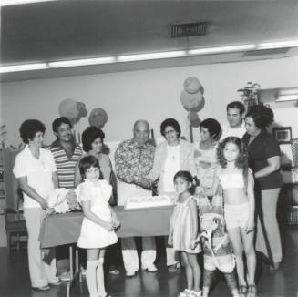 Unidentified Couple Celebrating With Cake  & Family - 3 of 3
