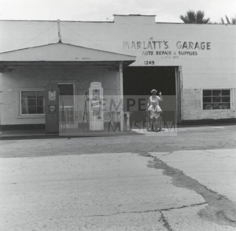 Marlatt's Garage & unidentified couple