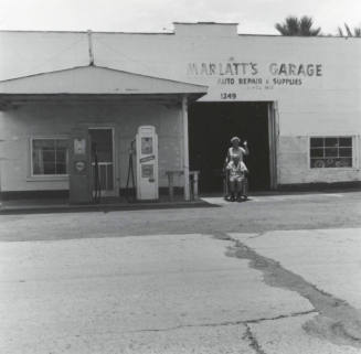Marlatt's Garage & unidentified couple