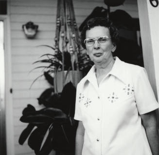Unidentified Woman Standing On Porch