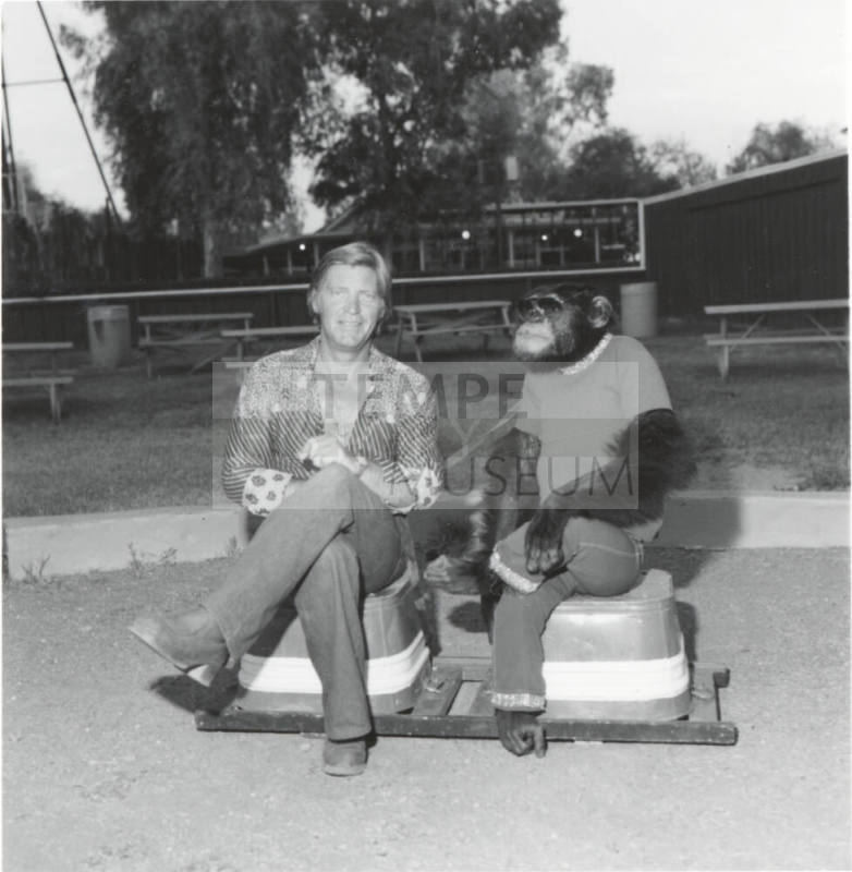 Chimpanzee and trainer at Legend City. - July 1977