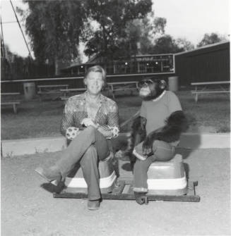 Chimpanzee and trainer at Legend City. - July 1977