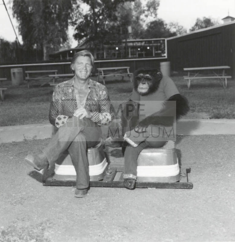 Chimpanzee and trainer at Legend City. - July 1977