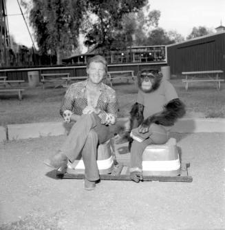 Chimpanzee and trainer at Legend City. - July 1977