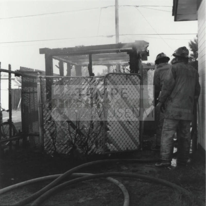 Two Firefighters In Yard