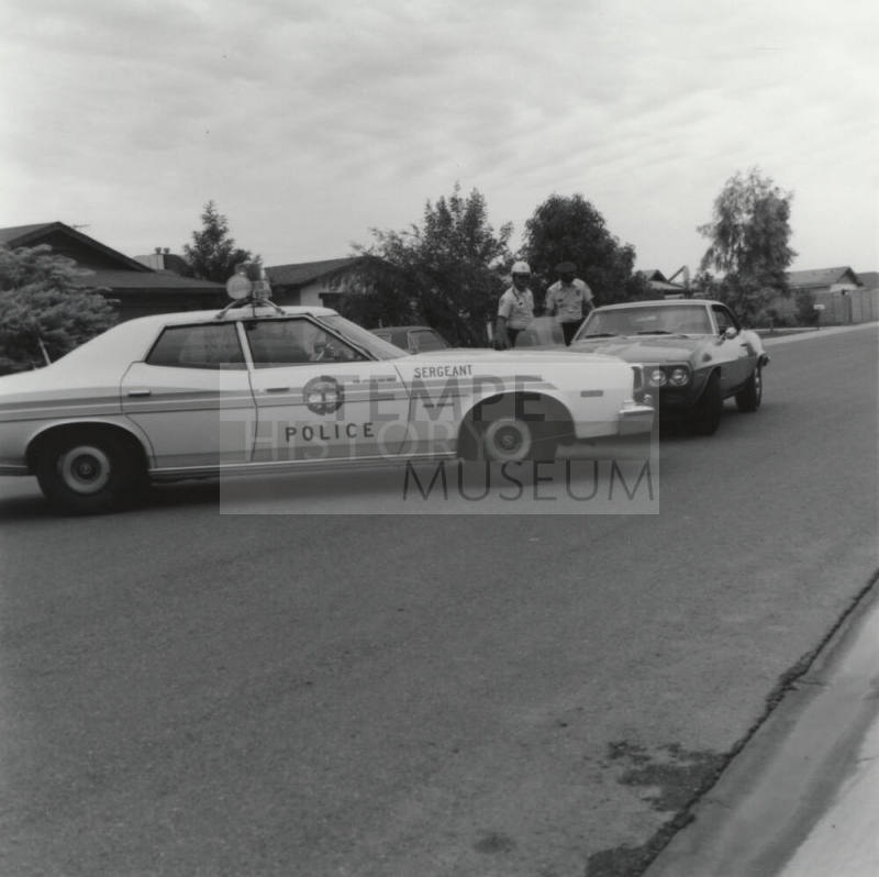Sergeant Police with Unidentified Car