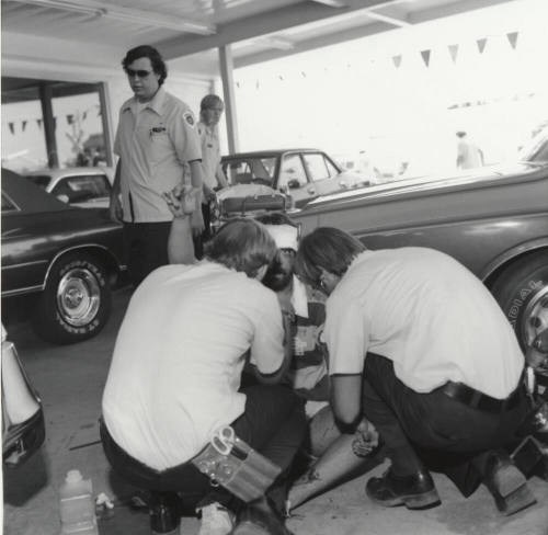 Paramedics tend to injury victim - Tempe Daily News, September 1977.