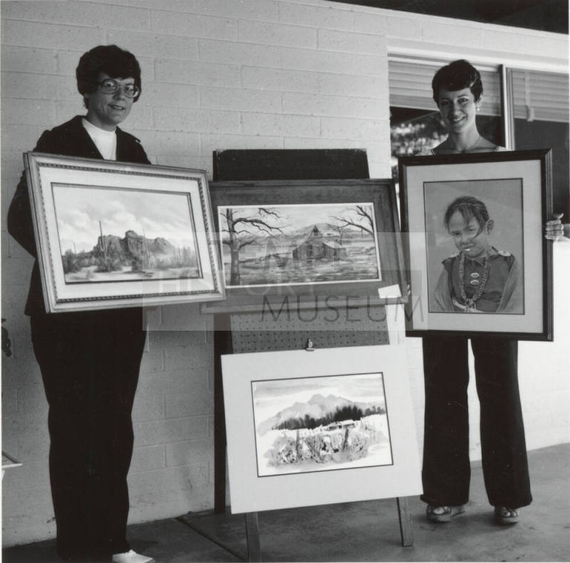 Two Women Posing with Southwestern Artwork -  September 1977