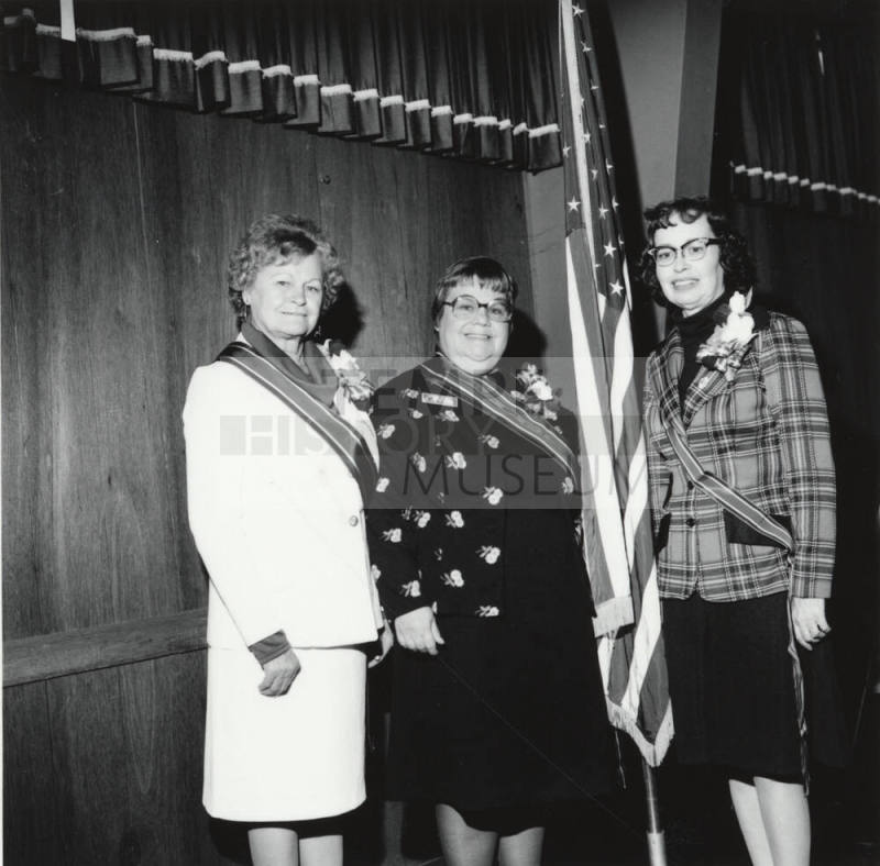 Three Unidentified Women Wearing Sashes