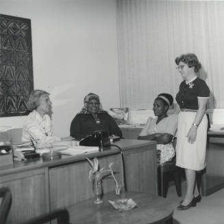 Women sitting. - October 1977