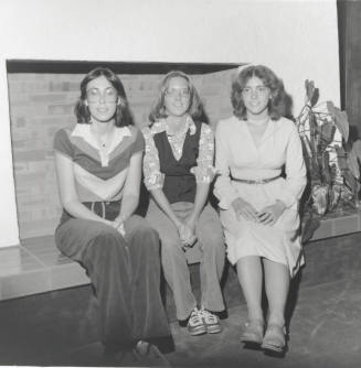 Three young women sitting