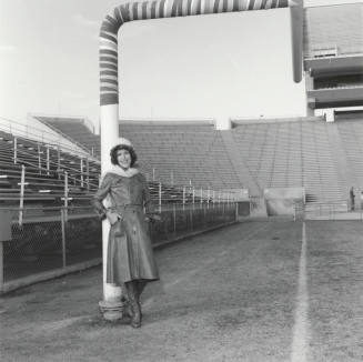 Woman Leans On Goal Post In Sun Devil Stadium