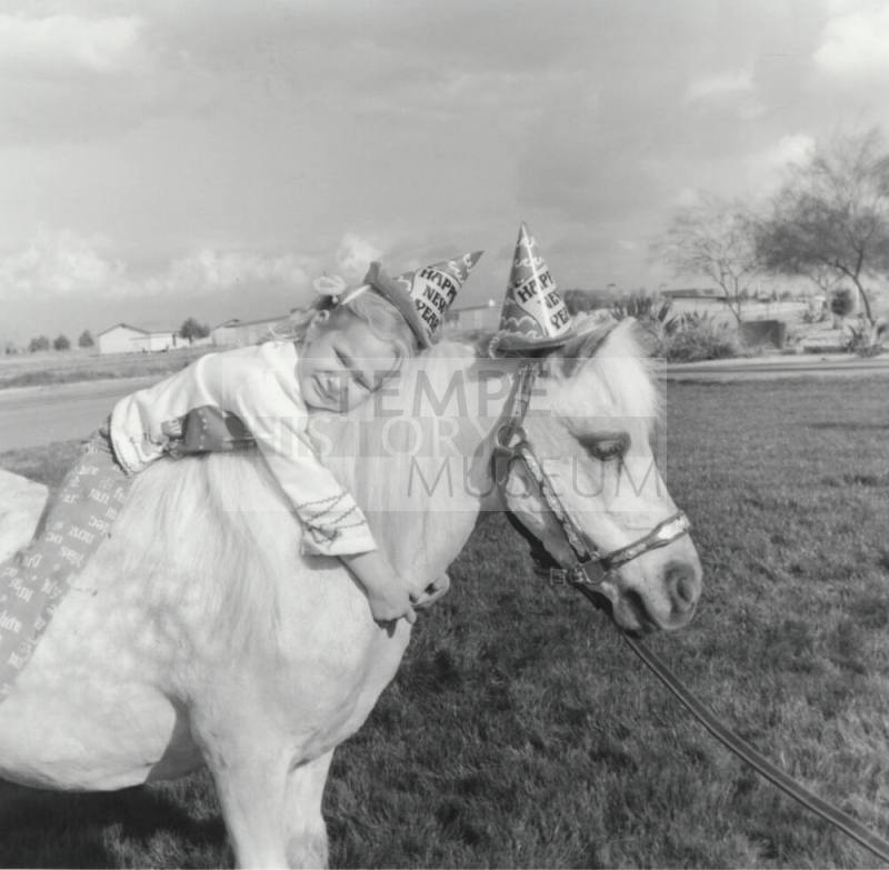 Girl Leaning on New Year Pony