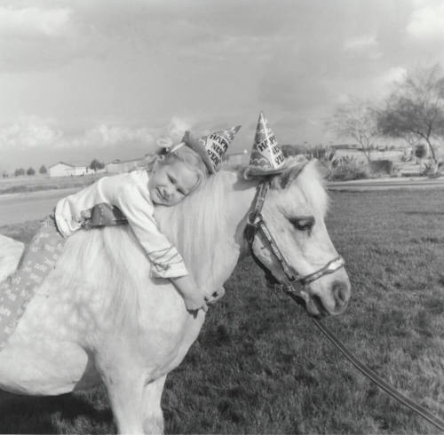 Girl Leaning on New Year Pony