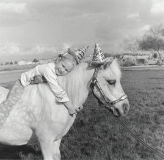 Girl Leaning on New Year Pony