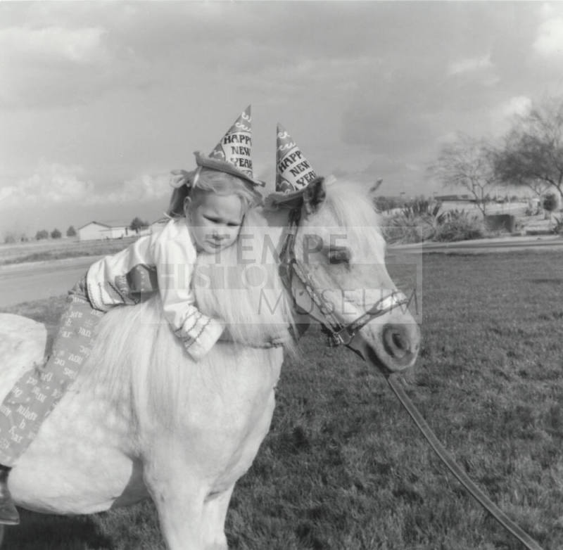 New Year Girl Holding On To Pony